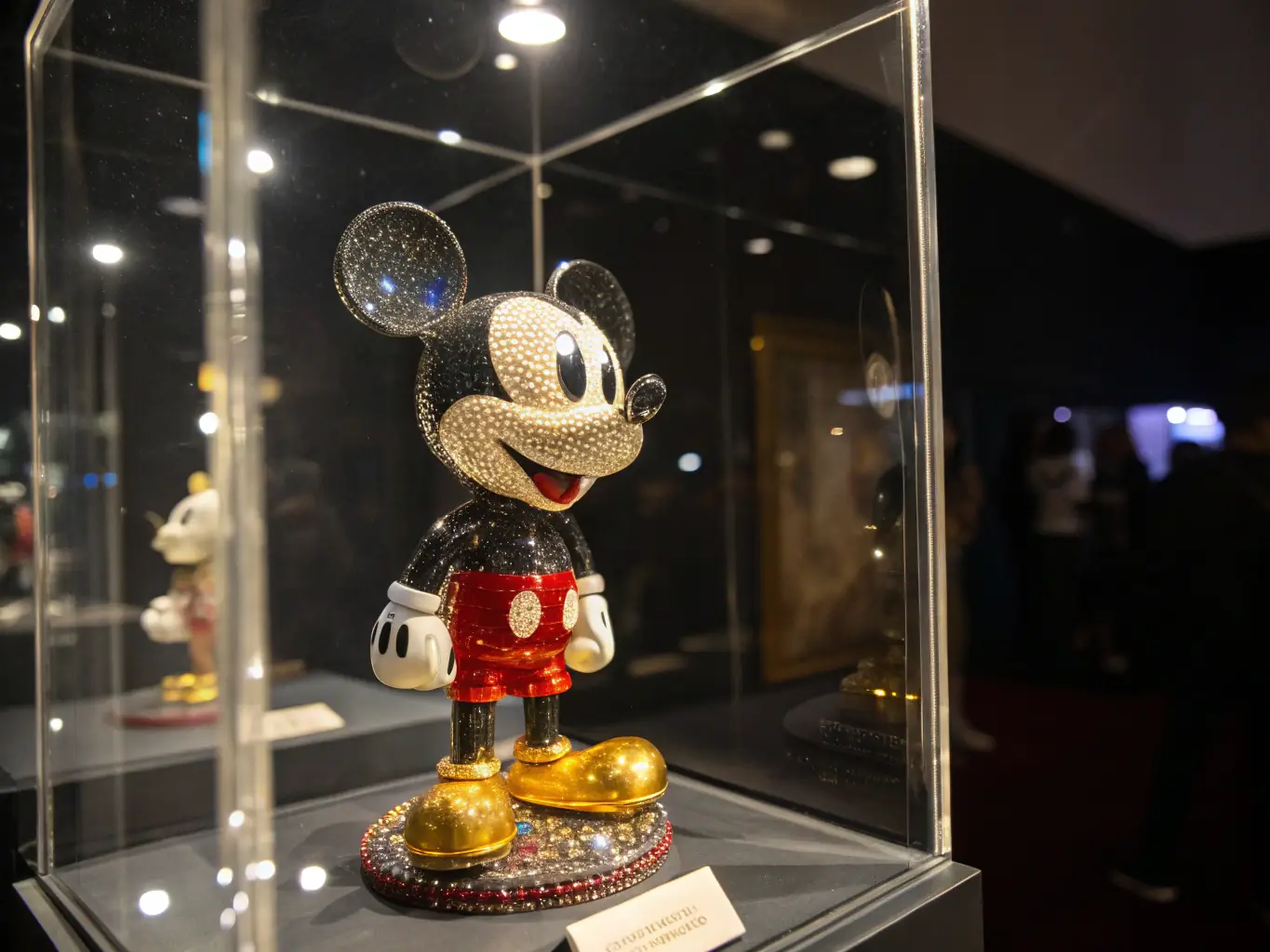 A close-up shot of rare and valuable Disney collectibles, including vintage figurines, limited-edition pins, and autographed memorabilia, displayed in a collector's case.